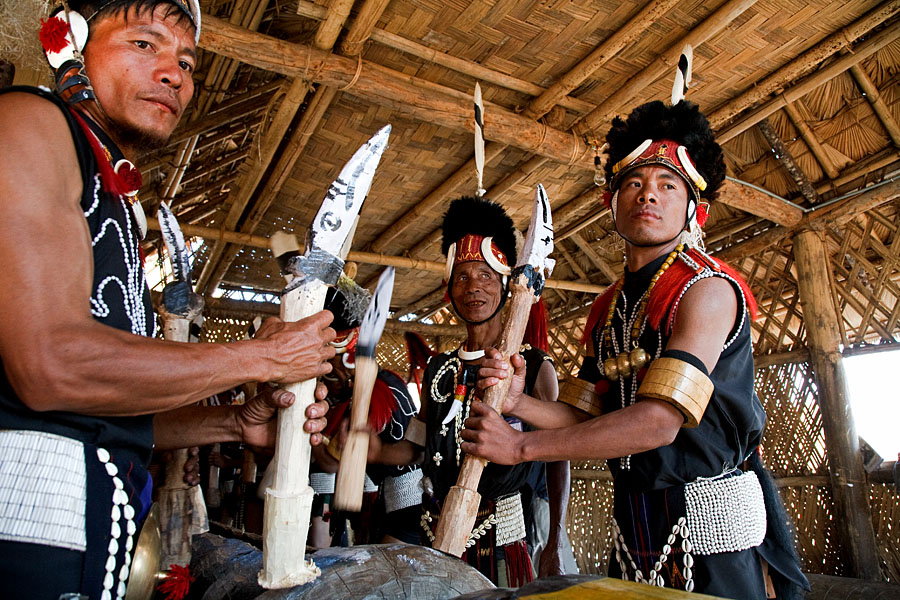  Phom tribes men beaten the log drum at their morung on the Hornbill festival   Kohima